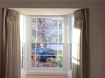 Double pleat bay window curtains with lath and fascia