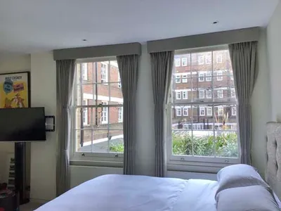 Pencil pleat lined curtains including pelmet