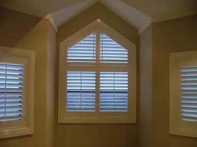 White painted shutters on a sash window